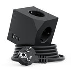 A black 3-in-1 power adapter cube with built-in USB-A and USB-C ports on one face and two European-style AC outlets on another, shown with its coiled black power cord and UK plug on a white background.
